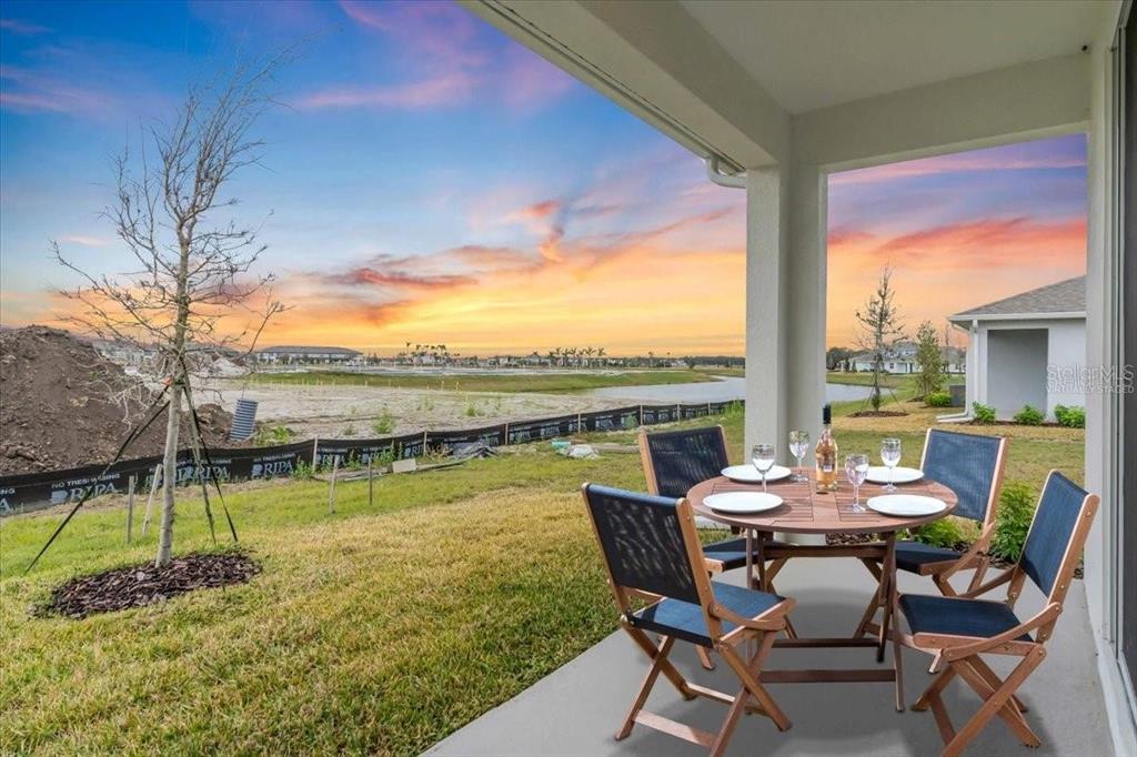 9258 Gulf Haven Drive Palmetto, FL 34221 - Photo 29 of 29 a view of swimming pool with table and chairs next to yard