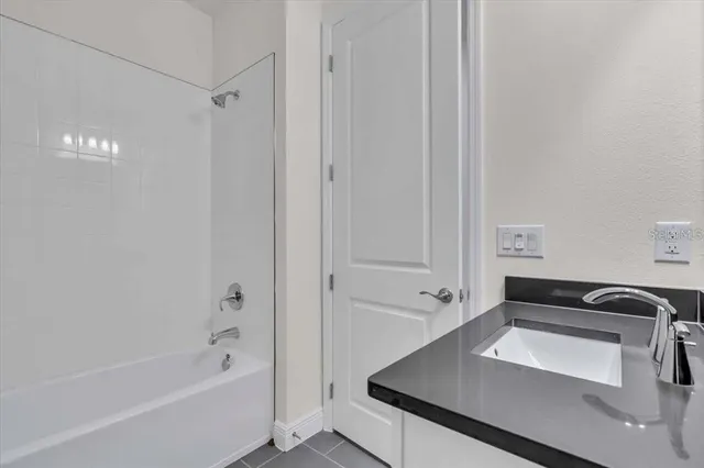 a bathroom with a bathtub and a sink