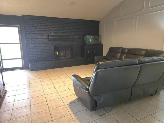 a living room with a couch and a fireplace