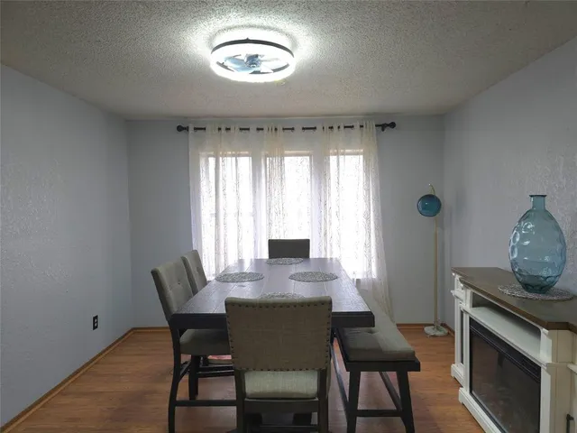 a view of a dining room with furniture and window