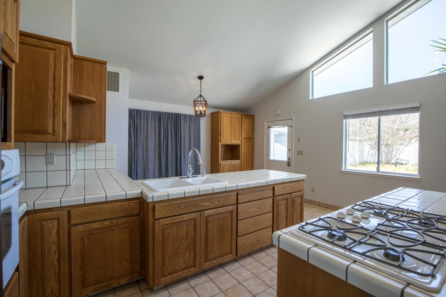 73 Webb Road Watsonville, CA 95076 - Photo 7 of 17 a kitchen that has a sink and a stove in it