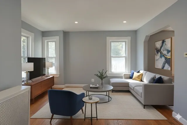 a living room with furniture and a flat screen tv