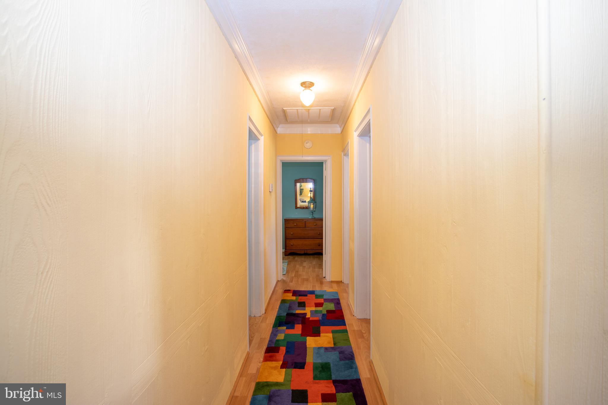 706 Travelers Rest Road Hague, VA 22469 - Photo 15 of 40 Hallway to the 3 bedrooms