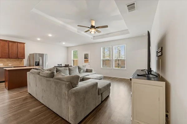 a living room with furniture and a fireplace