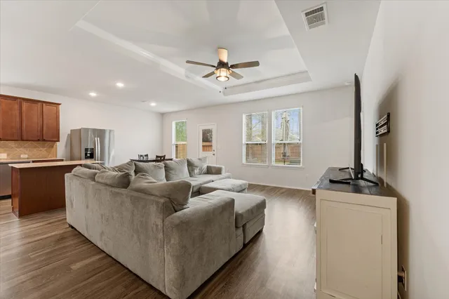 a living room with furniture and a fireplace