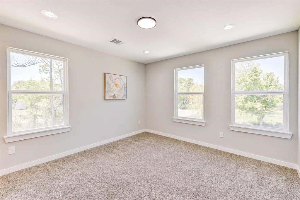 8404 Tate Street, Unit A Houston, TX 77028 - Photo 8 of 10 a view of an empty room with a window