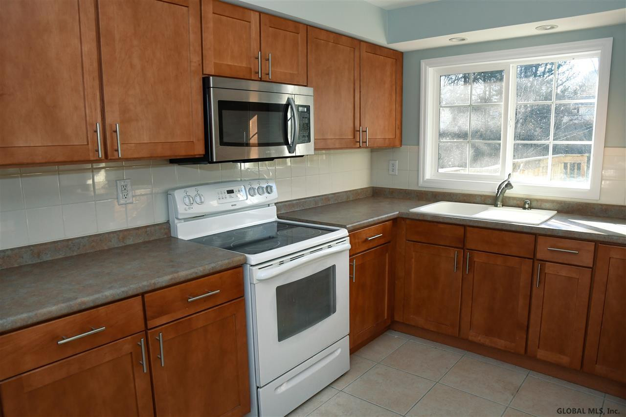 4 Wellington Road Bethlehem, NY 12054 - Photo 9 of 23 Plenty of cabinets including a pantry.