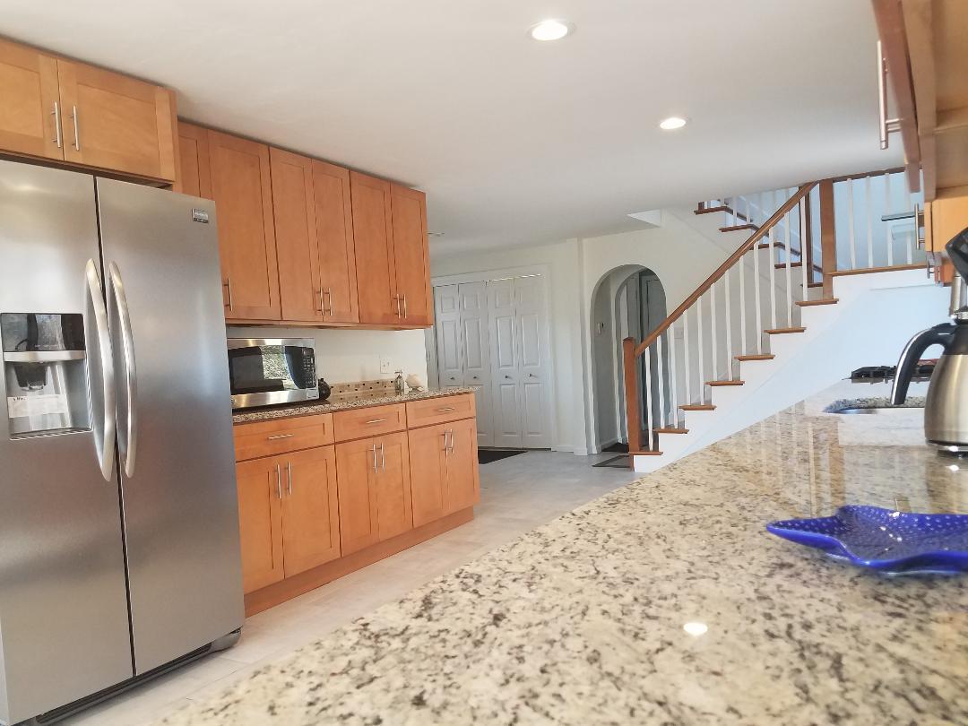 129 Elliott Road Centerville, MA 02632 - Photo 5 of 33 a kitchen with stainless steel appliances granite countertop a refrigerator and a sink