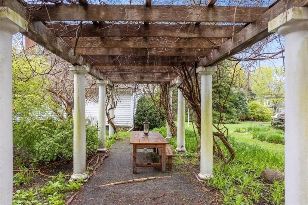 604 First Parish Road Scituate, MA 02066 - Photo 13 of 39 a view of a patio with table and chairs and potted plants
