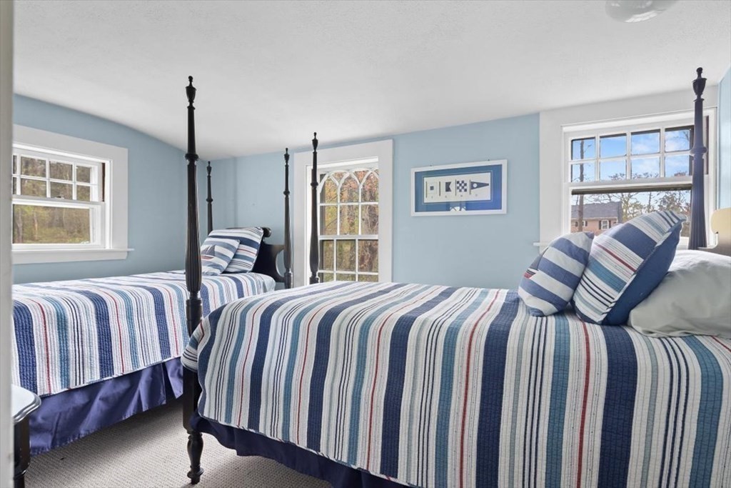 604 First Parish Road Scituate, MA 02066 - Photo 17 of 39 a bedroom with two beds and a window