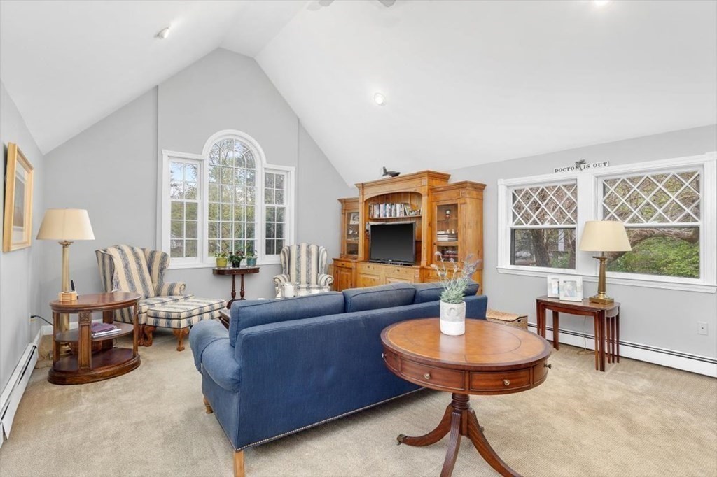 604 First Parish Road Scituate, MA 02066 - Photo 25 of 39 a living room with furniture a table and a large window