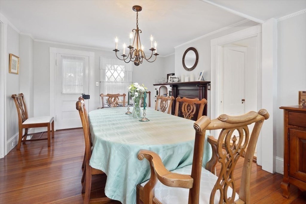 604 First Parish Road Scituate, MA 02066 - Photo 26 of 39 a view of a dining room with furniture and wooden floor