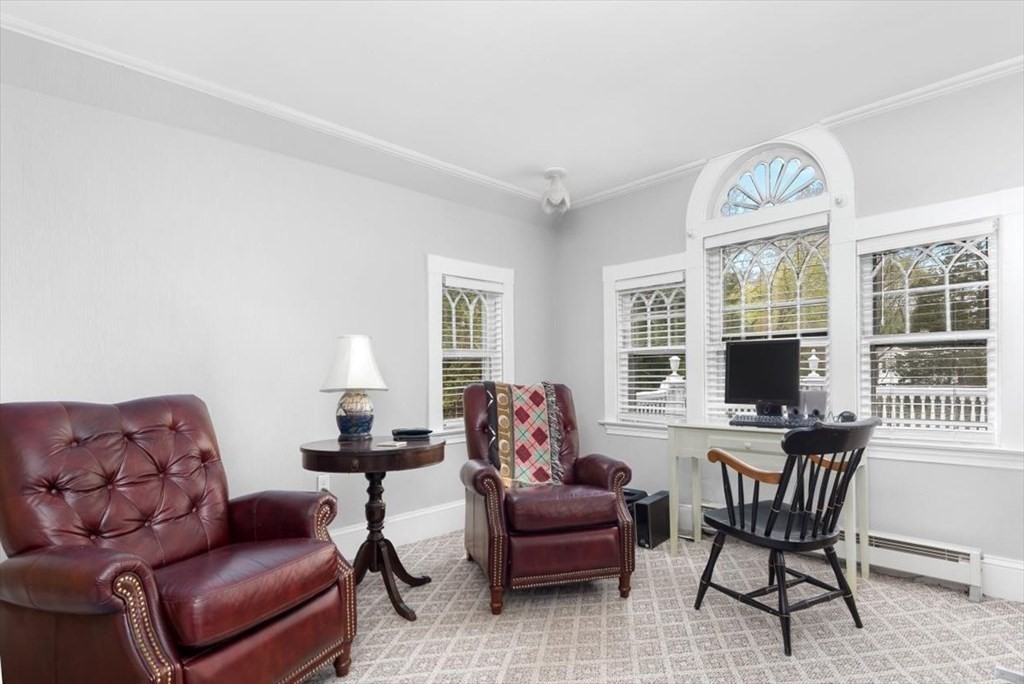 604 First Parish Road Scituate, MA 02066 - Photo 30 of 39 a living room with furniture two windows and a dining table