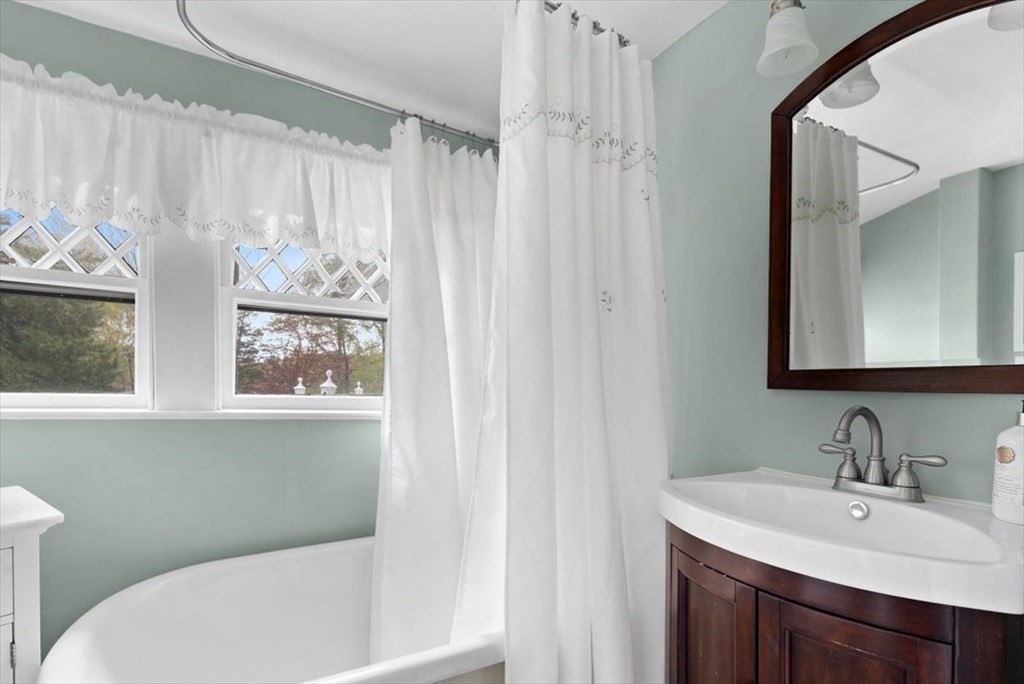 604 First Parish Road Scituate, MA 02066 - Photo 32 of 39 a bathroom with a sink vanity mirror and toilet