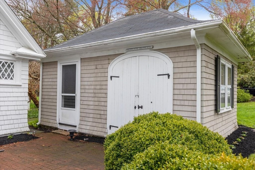 604 First Parish Road Scituate, MA 02066 - Photo 34 of 39 a front view of a house with garden