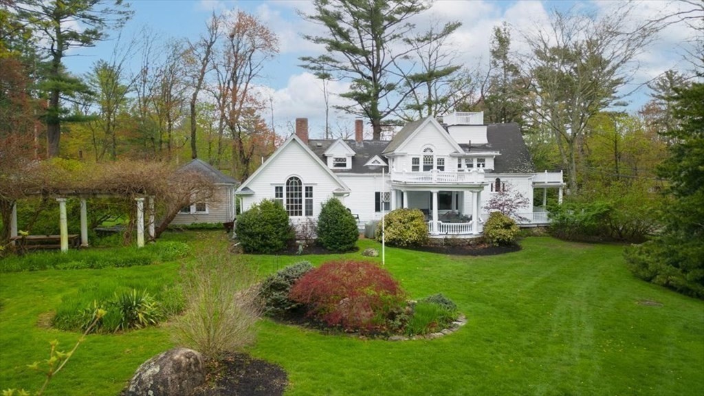 604 First Parish Road Scituate, MA 02066 - Photo 5 of 39 a front view of a house with garden and trees