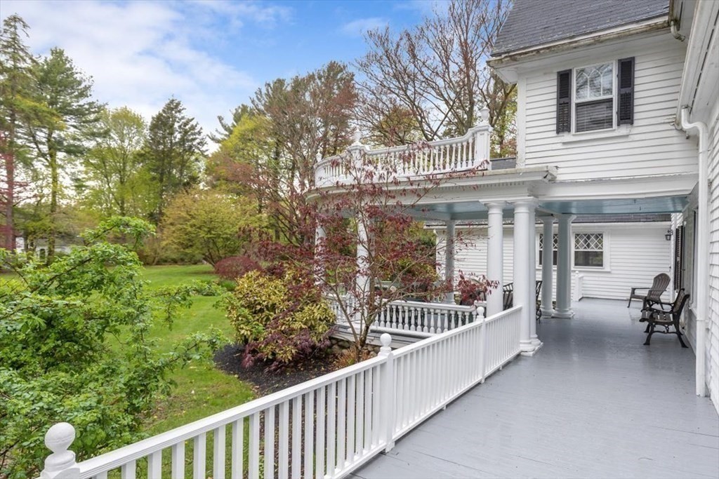 604 First Parish Road Scituate, MA 02066 - Photo 7 of 39 a view of a house with large window and table and chairs