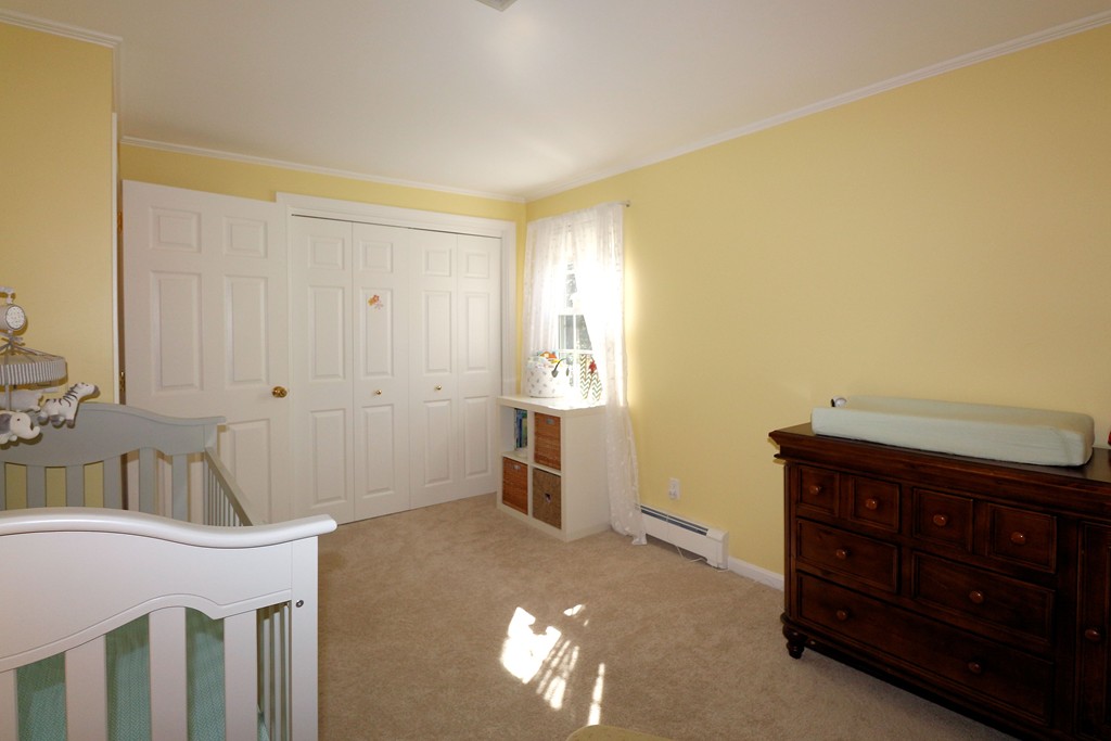 464 Great Road Stow, MA 01775 - Photo 17 of 28 a bedroom with a bed and a dresser