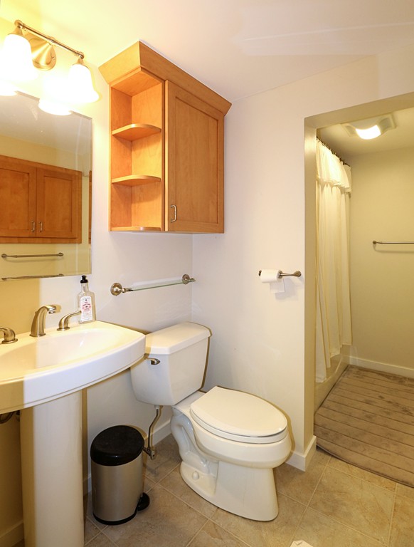 464 Great Road Stow, MA 01775 - Photo 21 of 28 a bathroom with a toilet sink and mirror