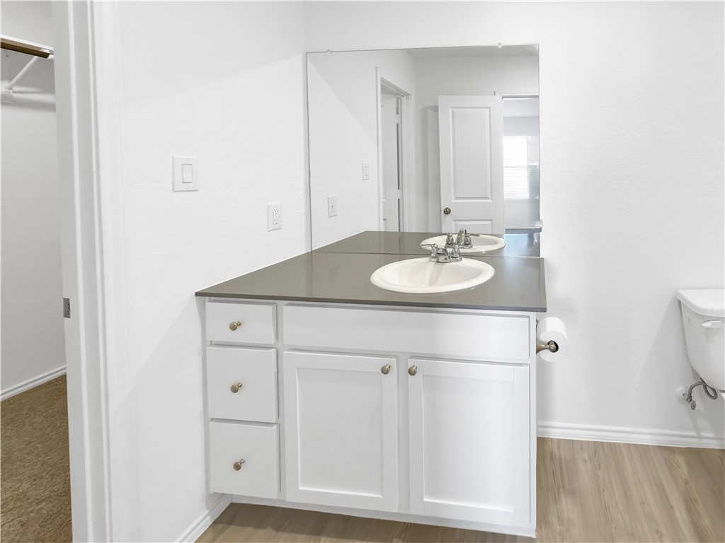 9238 Wilde Way Corpus Christi, TX 78410 - Photo 14 of 26 a bathroom with a sink and a mirror