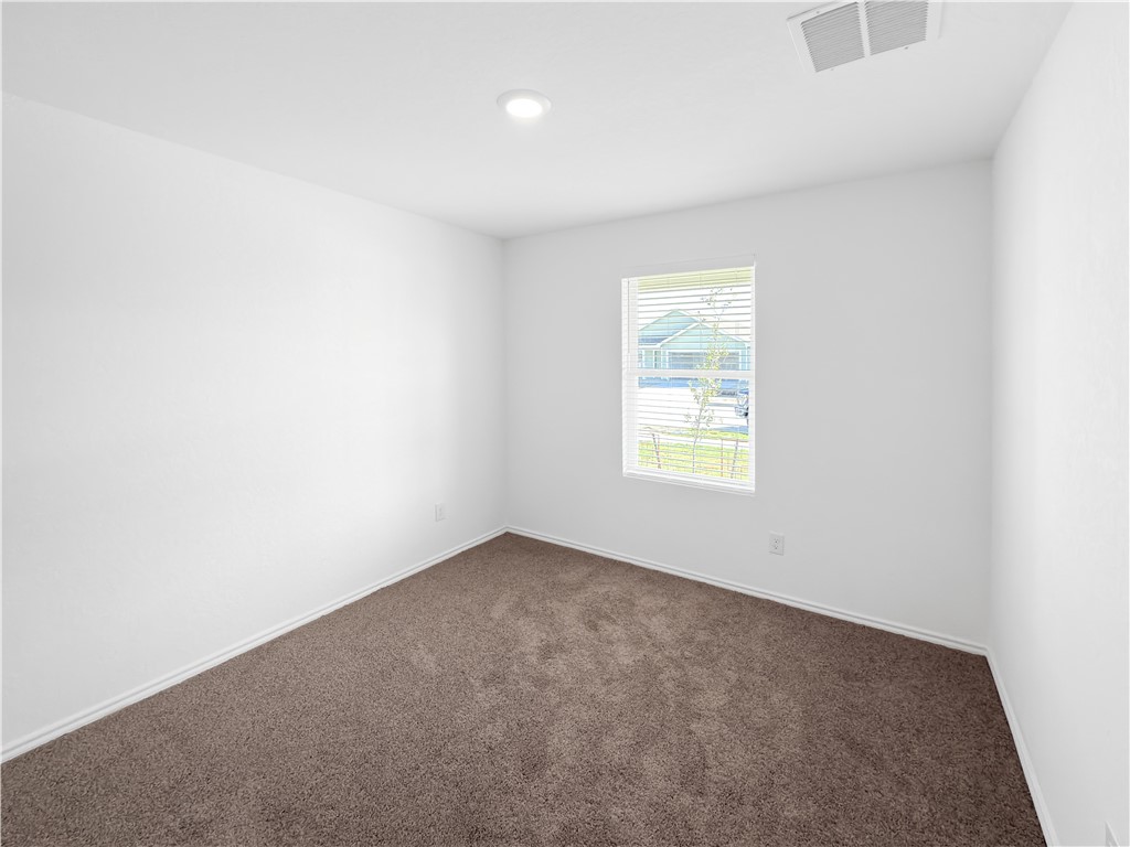 9238 Wilde Way Corpus Christi, TX 78410 - Photo 18 of 26 an empty room with windows