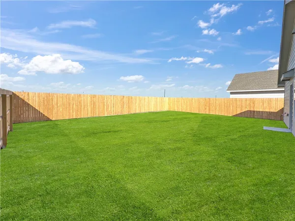 a view of yard with swimming pool and outdoor seating
