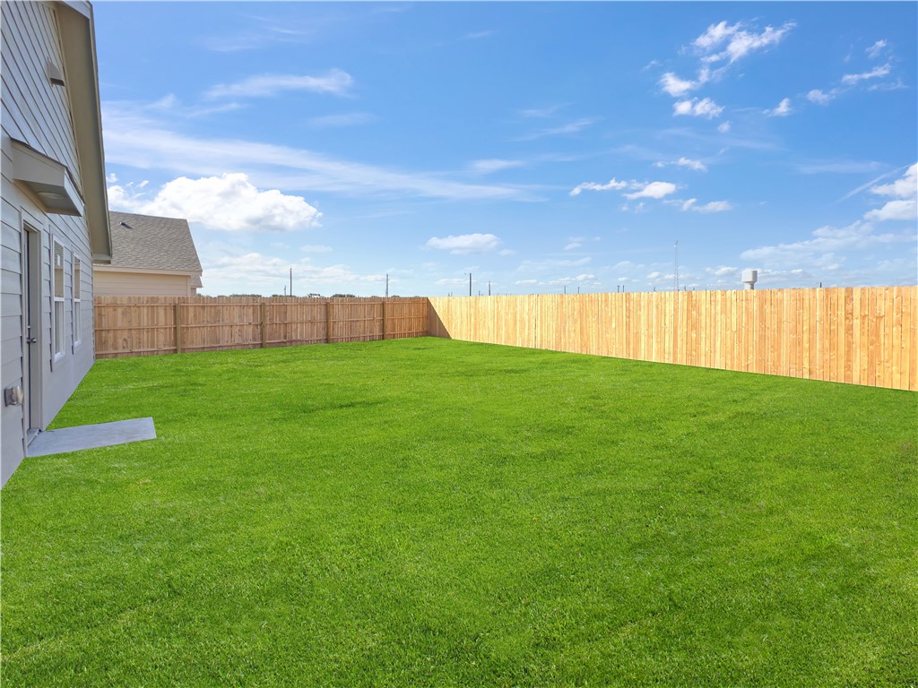 9238 Wilde Way Corpus Christi, TX 78410 - Photo 26 of 26 a view of an empty room with kitchen and a garden