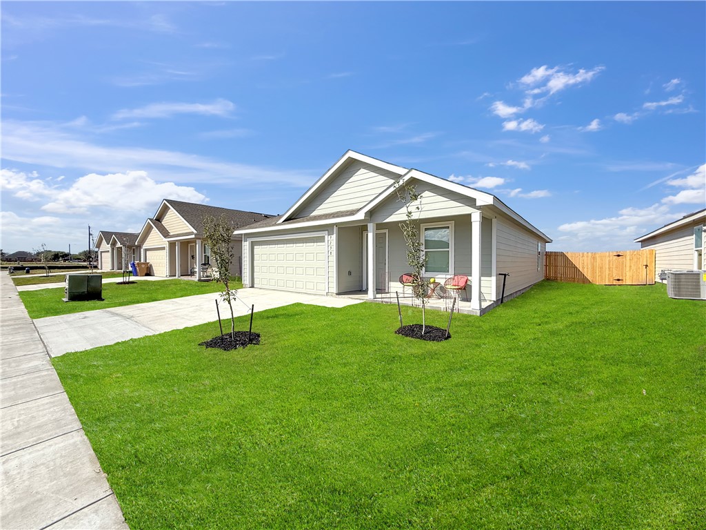 9238 Wilde Way Corpus Christi, TX 78410 - Photo 3 of 26 a front view of house with yard and green space