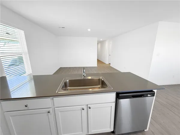 a kitchen with a sink and cabinets
