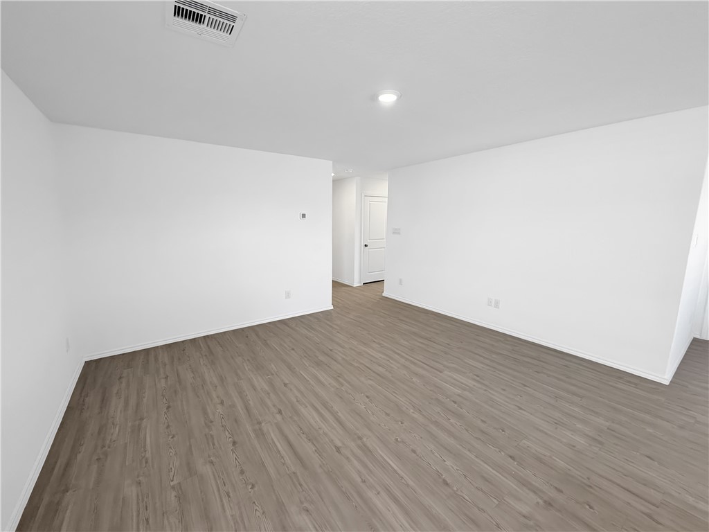 9238 Wilde Way Corpus Christi, TX 78410 - Photo 10 of 26 an empty room with wooden floor