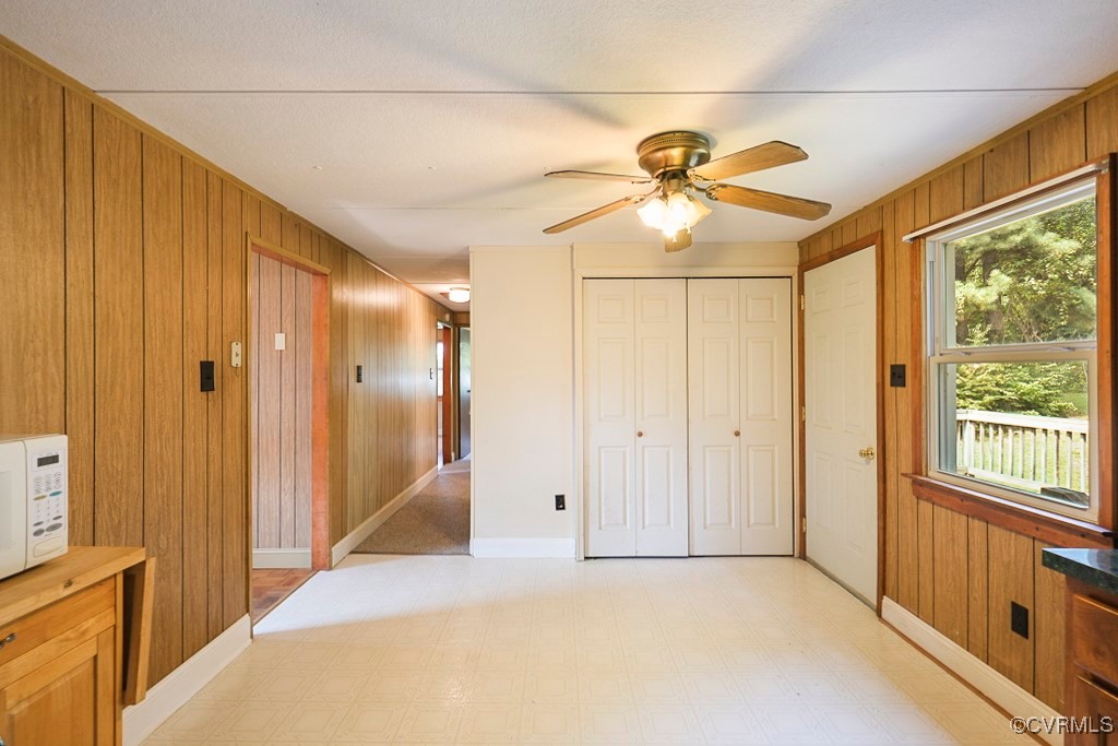 275 Station Road Charlotte Court House, VA 23923 - Photo 8 of 33 Unfurnished bedroom with ceiling fan, a closet, wo