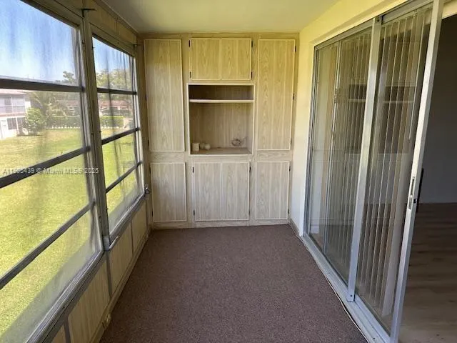 a view of hallway with a large window