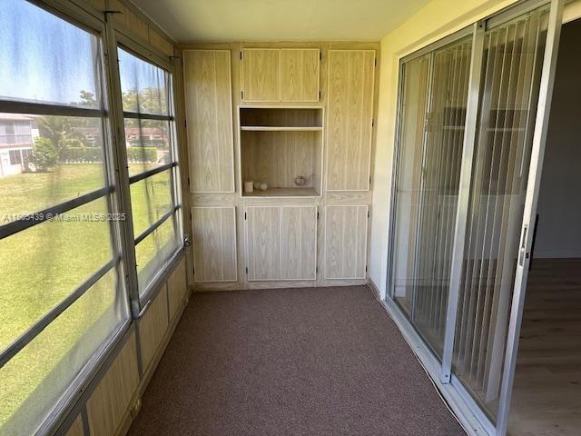 a view of hallway with a large window