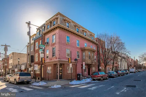 a front view of a building with street view