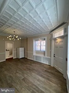 a view of an empty room with window and fireplace
