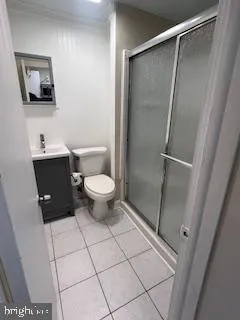 a bathroom with a toilet a sink and shower