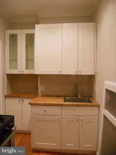 a view of cabinets with wooden floor
