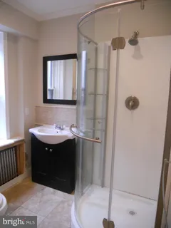 a bathroom with a sink and mirror