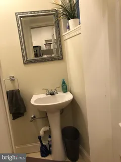 a bathroom with a sink and mirror