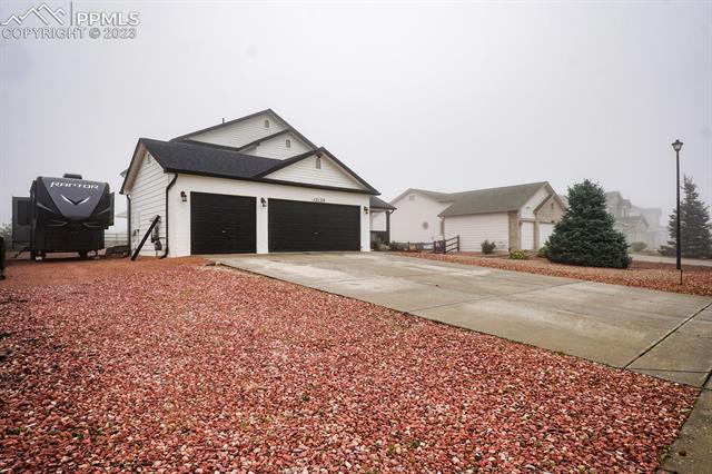 12130 Rio Secco Road Peyton, CO 80831 - Photo 3 of 40 3 car garage and large fun yard