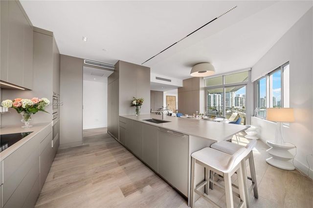 a kitchen with a potted plant on the counter top