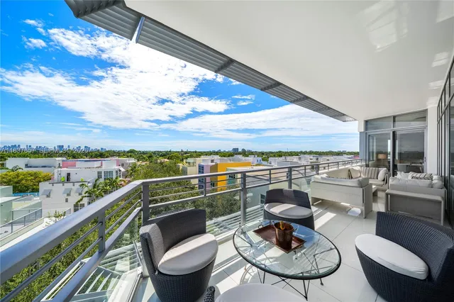 a view of a balcony with mountain view and wooden floor