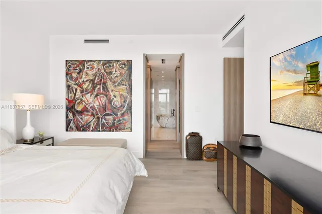 a spacious bathroom with a double vanity sink and mirror