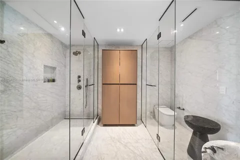 a view of a balcony with two chairs