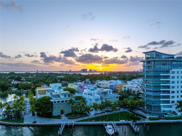 a view of a swimming pool and a back yard