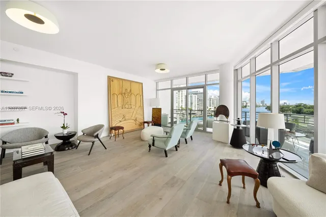 a living room with furniture or couch and a large window