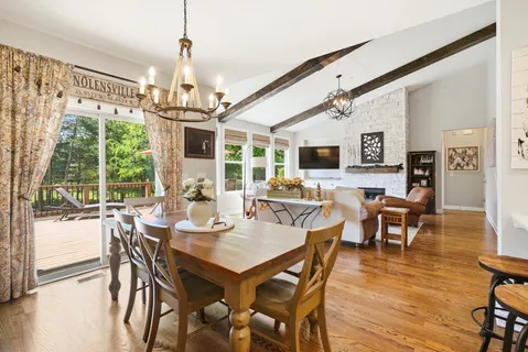 a kitchen with stainless steel appliances white cabinets and a refrigerator