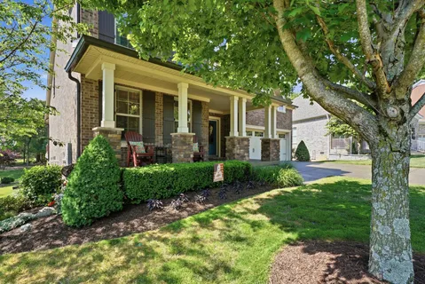front view of a house with a yard