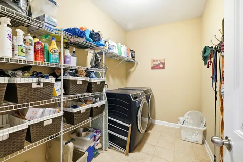 a bathroom with a double vanity sink toilet and shower