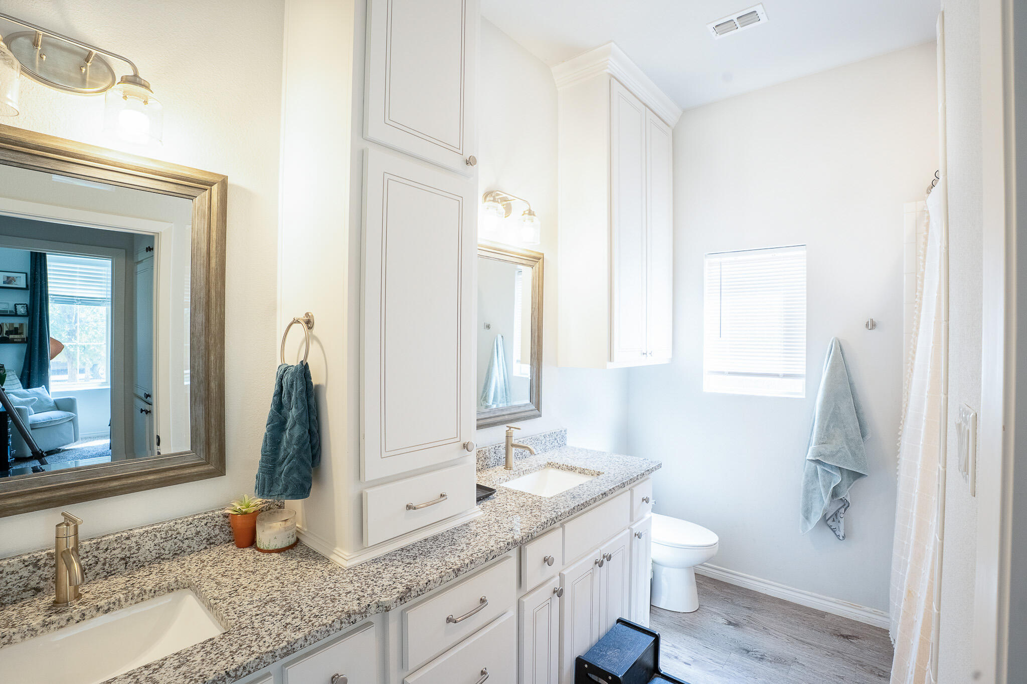3436 125th Street Lubbock, TX 79423 - Photo 15 of 22 a bathroom with a granite countertop sink and a mirror